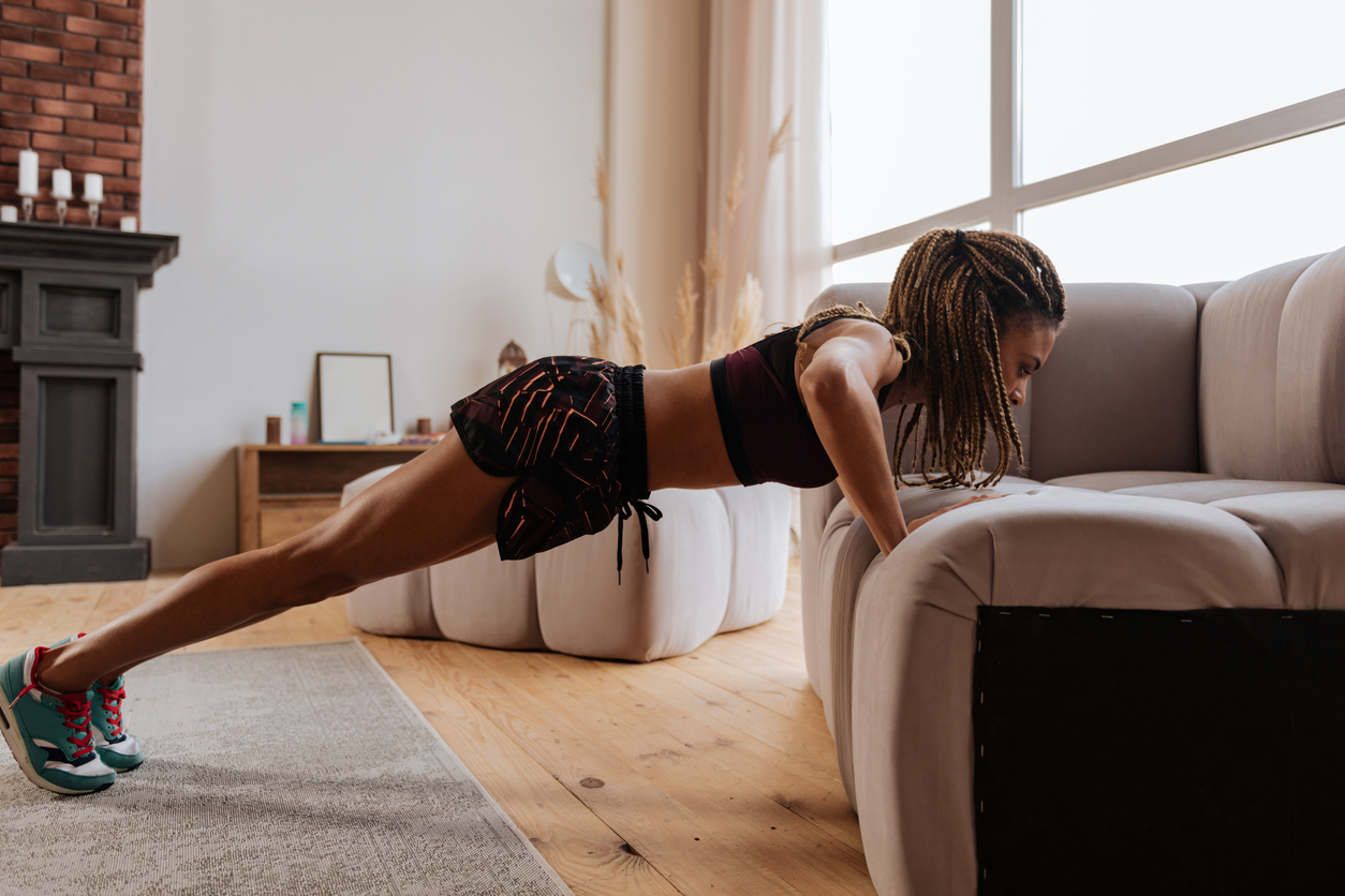 Woman exercising and losing weight from home